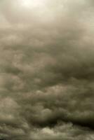 a man standing on a hill with a kite in the air photo