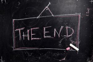 the end written on a chalkboard with chalk photo