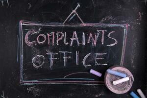 complaints office - chalkboard with chalk writing photo
