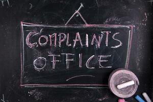complaints office - chalkboard with chalk writing photo