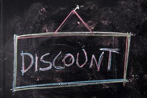 Written blackboard with discounts photo