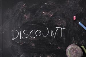 Written blackboard with discounts photo