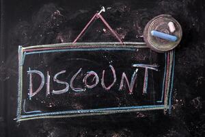 Written blackboard with discounts photo