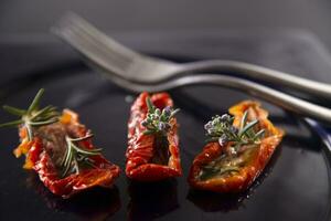 Dried tomatoes with rosemary photo
