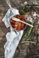 Dried tomatoes with rosemary photo