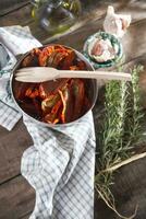 Dried tomatoes with rosemary photo