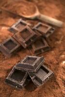 Cubes of dark chocolate photo