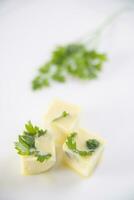 Oil cube frozen with parsley photo