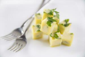 Oil cube frozen with parsley photo