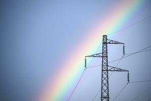 Rainbow through power line photo