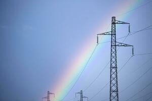 Rainbow through power line photo