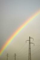 Rainbow through power line photo