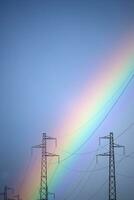Rainbow through power line photo