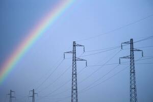 Rainbow through power line photo