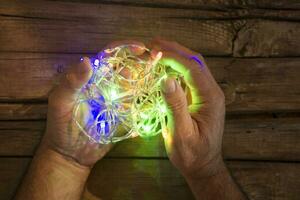 Small Christmas lights in hand photo