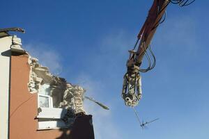 The controlled demolition of a house photo