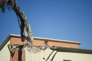 The controlled demolition of a house photo