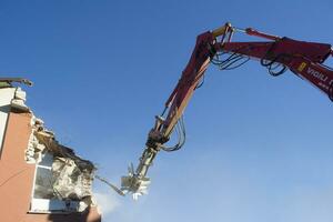 The controlled demolition of a house photo