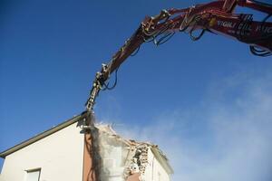 The controlled demolition of a house photo