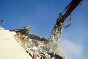 The controlled demolition of a house photo