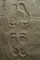 Foot prints in the sand photo