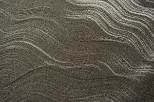 Waves of gray sand photo