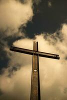 Iron cross and cloudy sky photo