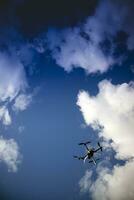 Drone in flight with cloudy sky photo