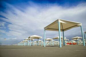 Autumnal view of the gazebos on the beach of Viareggio photo