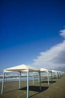 Autumnal view of the gazebos on the beach of Viareggio photo