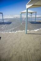 Autumnal view of the gazebos on the beach of Viareggio photo