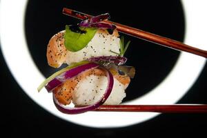 Sushi with red onion garnish photo