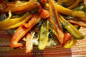 Sweet and colorful peppers baked in the oven photo