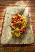 Oven-baked colored pepper cubes photo