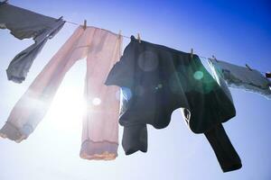 Laundry hanging out in the sun photo