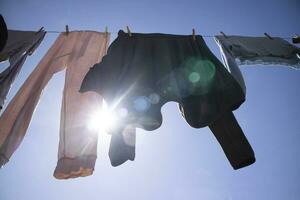 Laundry hanging out in the sun photo