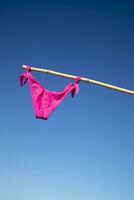 Colorful female swimsuit to dry in the sun photo