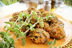 Falafel prepared with carrots and various spices photo