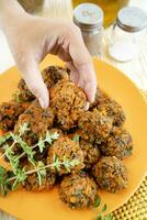 Falafel prepared with carrots and various spices photo
