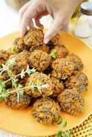 Falafel prepared with carrots and various spices photo