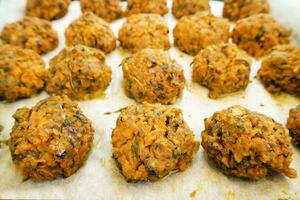 Falafel prepared with freshly baked carrots and various spices photo