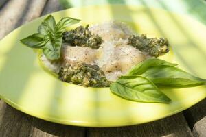 Legume ravioli with chickpeas and lentils in basil sauce photo