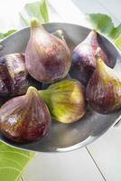 Tray of fragrant fresh seasonal figs photo