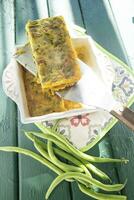 Vegan cooking savory pie with chickpea flour and green beans photo