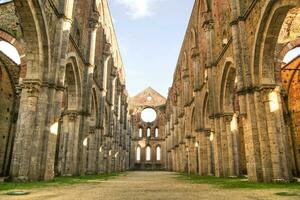 The famous roofless church in San Galgano Tuscany Italy photo