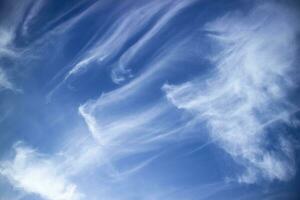 Layers of white clouds in blue sky photo