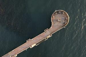 Aerial view at sunset of the pier in Marina di Massa Tuscany Italy photo