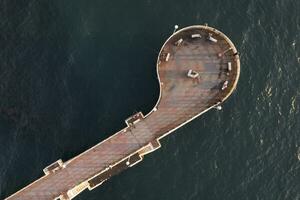 Aerial view at sunset of the pier in Marina di Massa Tuscany Italy photo