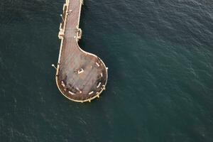 Aerial view at sunset of the pier in Marina di Massa Tuscany Italy photo