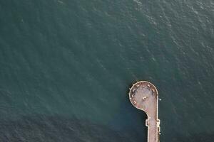 Aerial view at sunset of the pier in Marina di Massa Tuscany Italy photo